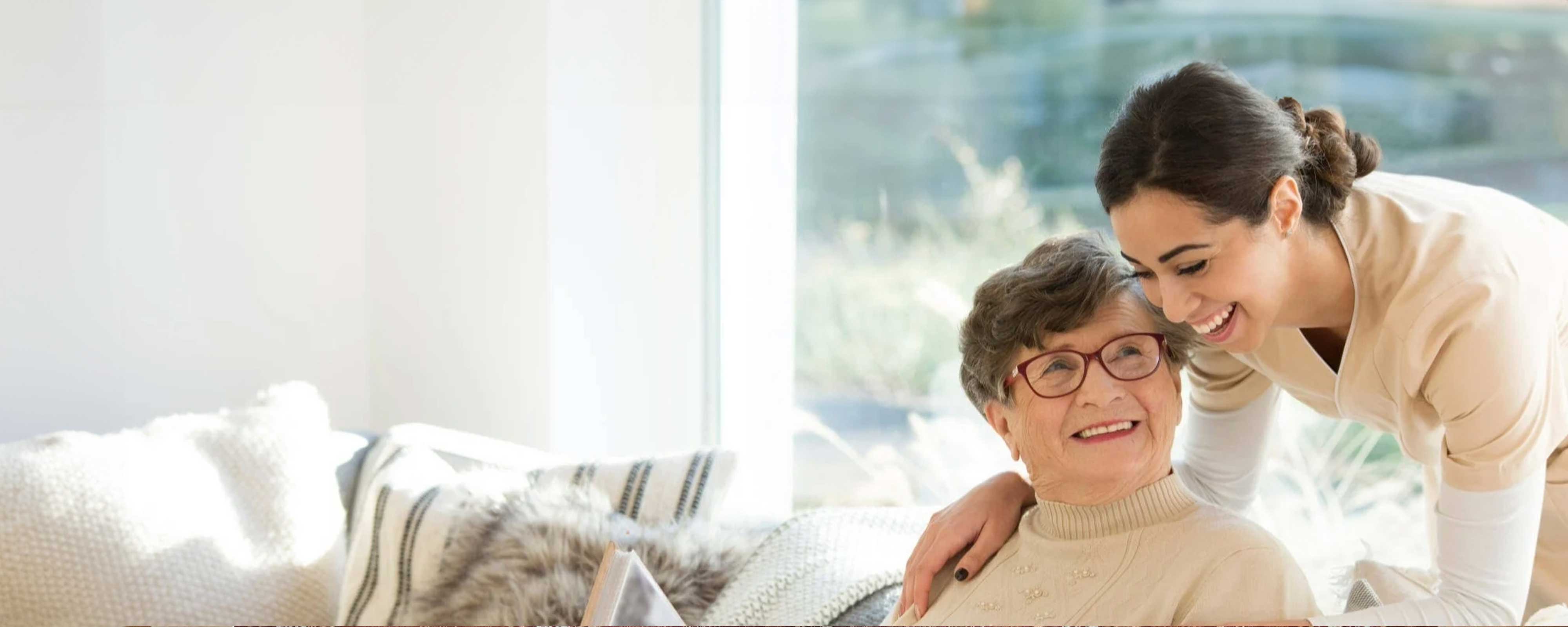 A senior and younger woman having a conversation